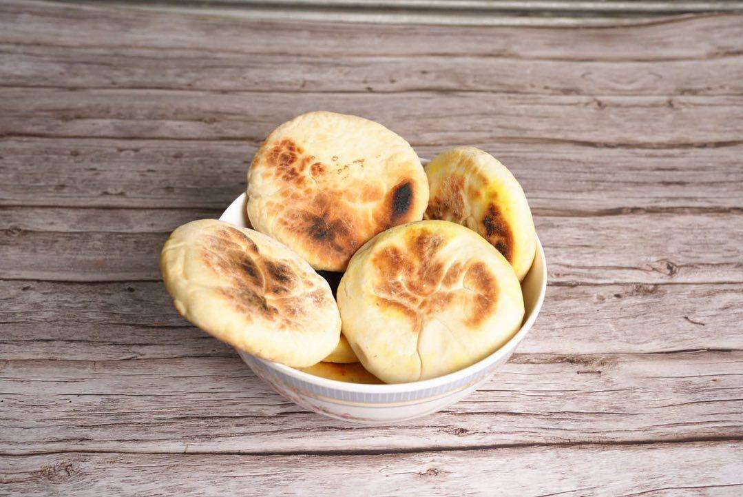 Tibetan Bhalep served in a white bowl against a wood background
