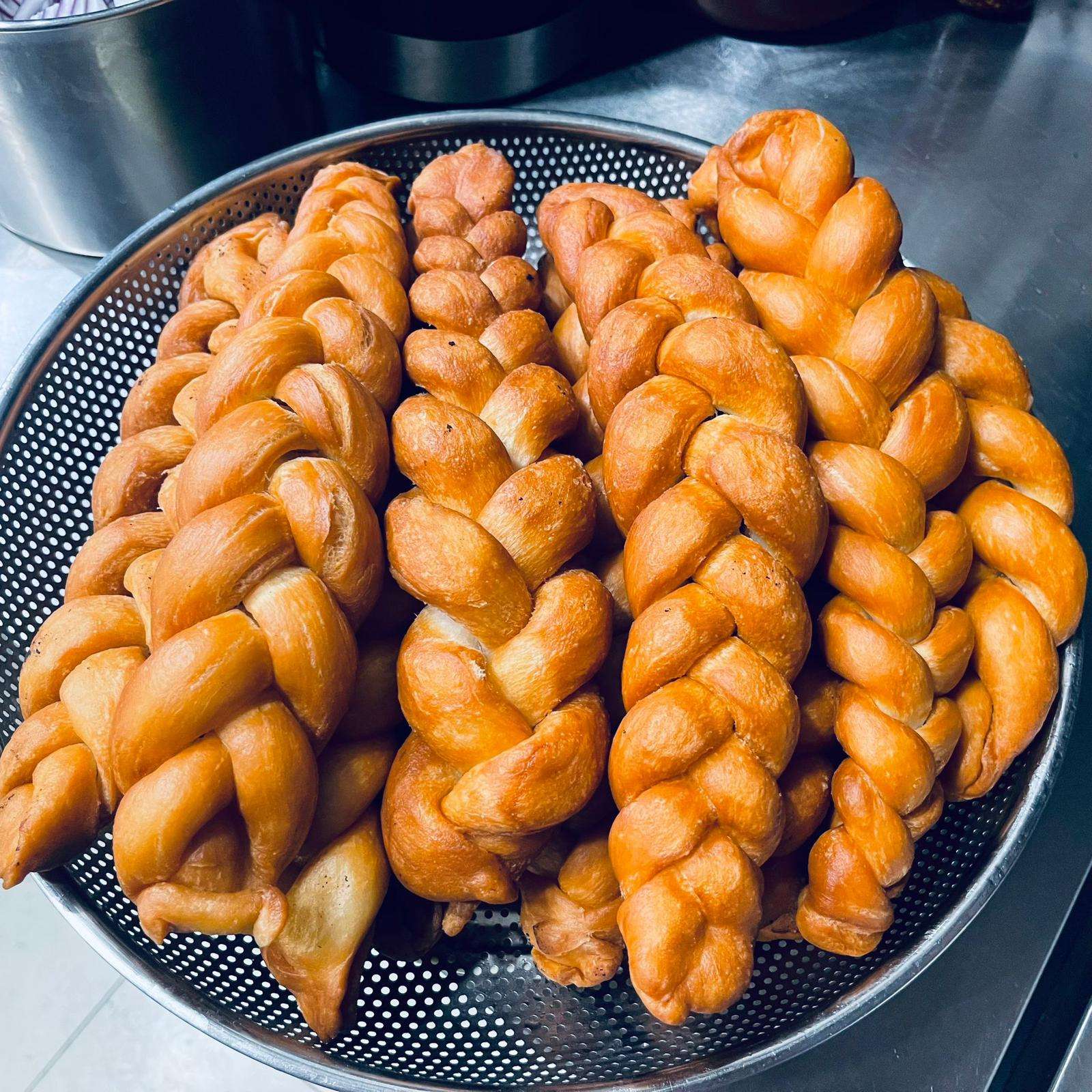 Tibetan Khabse freshly cooked, on a strainer in the kitchen.