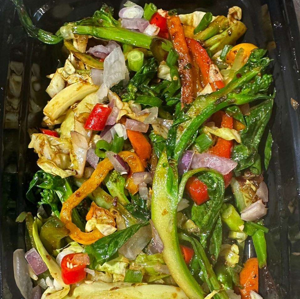 Spicy Mixed Vegetables in a black container.